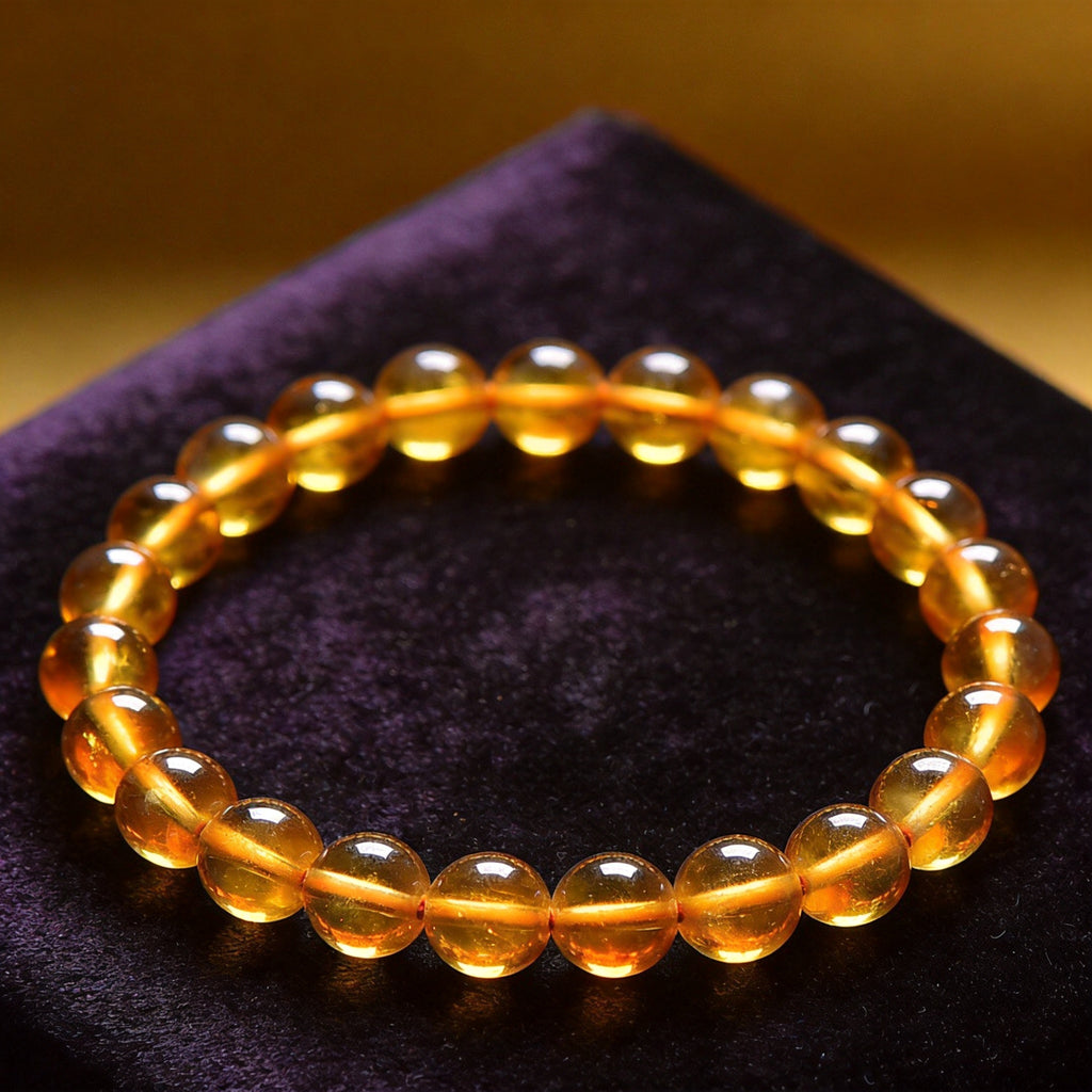 Amber Women's 8mm natural stone bracelet on dark velvet