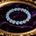 Aquamarine Women's 8mm natural stone bracelet on dark velvet