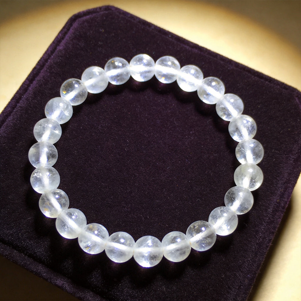 Clear Quartz Women's 8mm natural stone bracelet on dark velvet