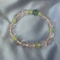 Rose quartz, prehnite and aquamarine generating-cycle combo bracelet on dark cloth