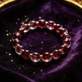 Garnet Women's 8mm natural stone bracelet on dark velvet