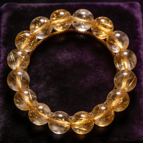 Gold Rutilated Quartz Men's 12mm natural stone bracelet on dark velvet