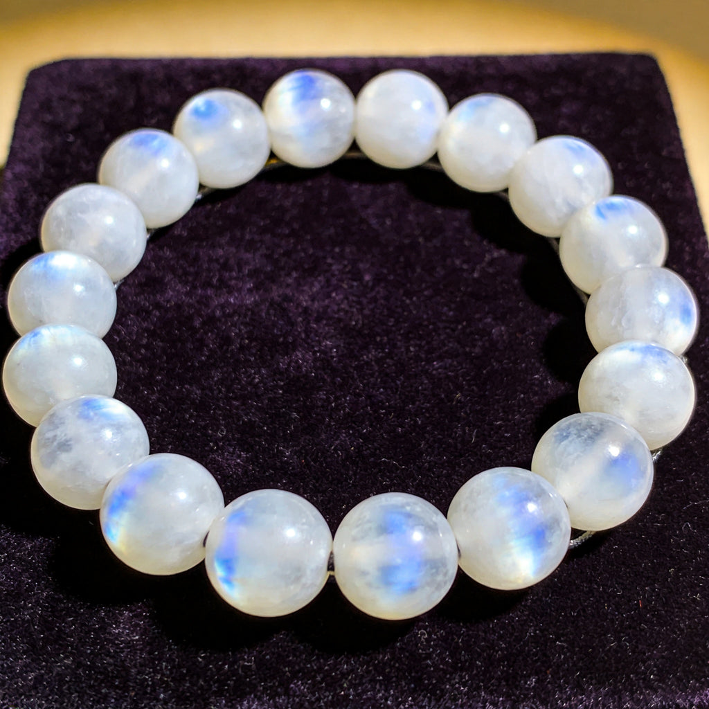 Moonstone Men's 12mm natural stone bracelet on dark velvet