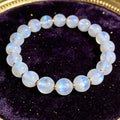 Moonstone Women's 8mm natural stone bracelet on dark velvet