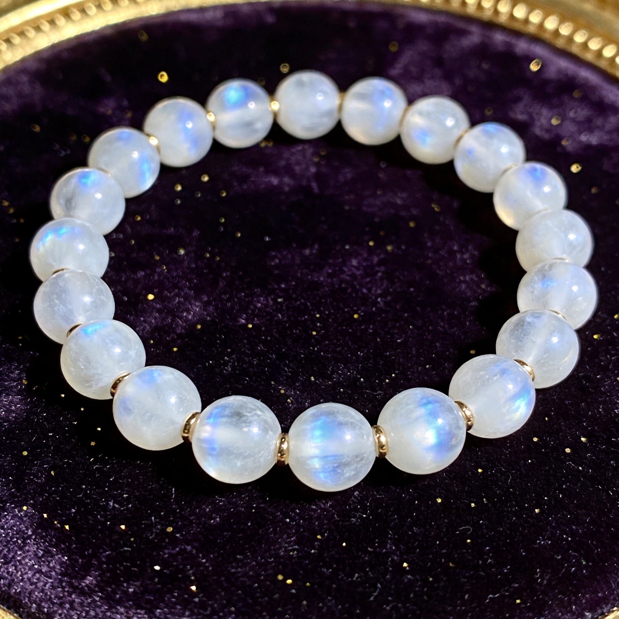 Moonstone Women's 8mm natural stone bracelet on dark velvet