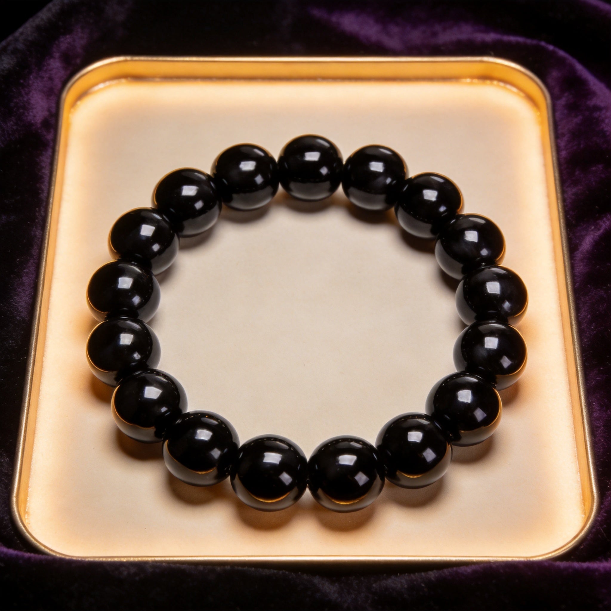 Black Obsidian Men's 12mm natural stone bracelet on dark velvet