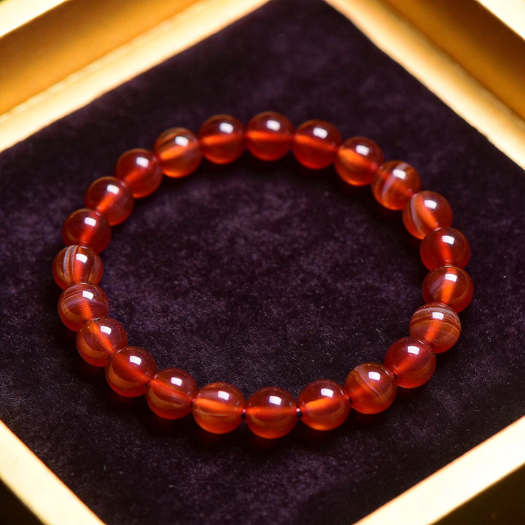 Red Agate Women's 8mm natural stone bracelet on dark velvet