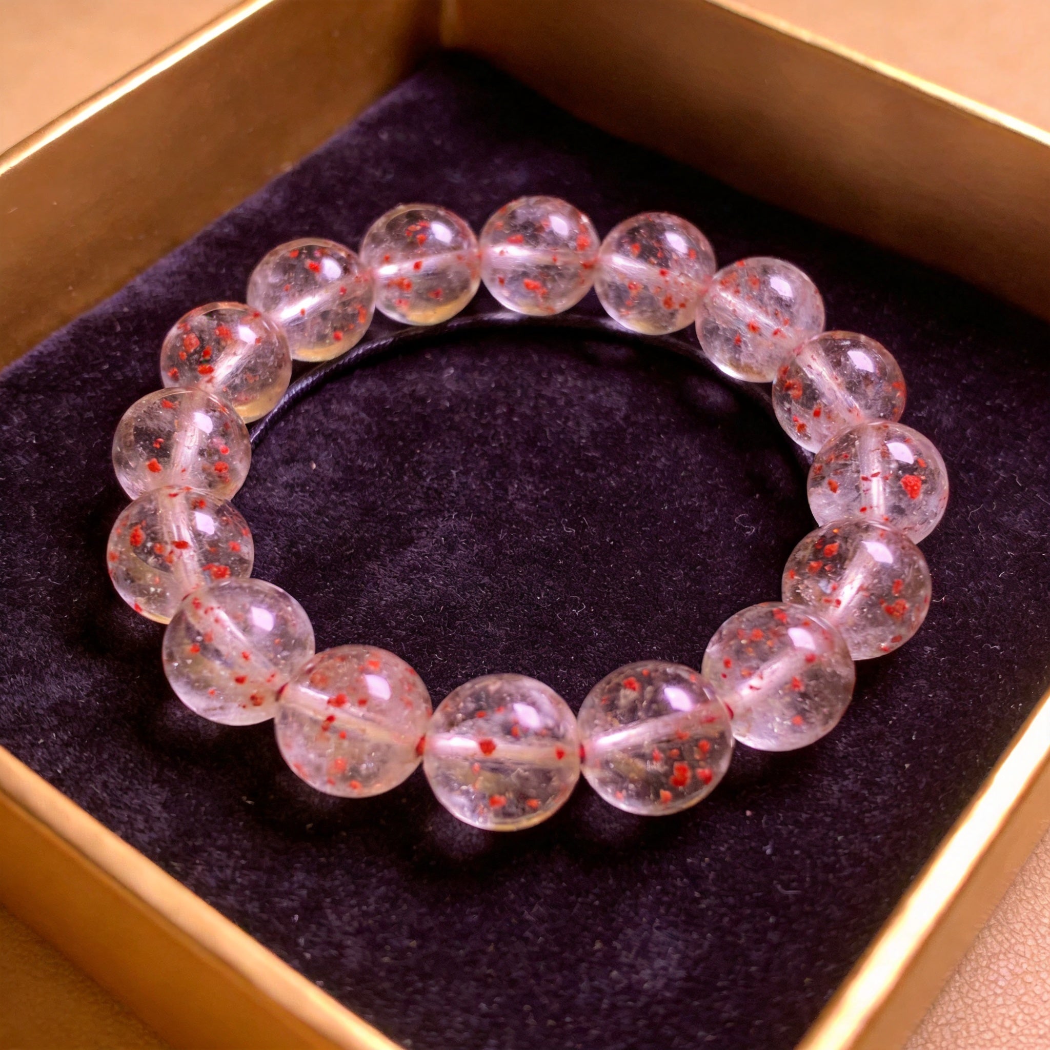 Strawberry Quartz Men's 12mm natural stone bracelet on dark velvet