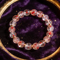 Strawberry Quartz Women's 8mm natural stone bracelet on dark velvet