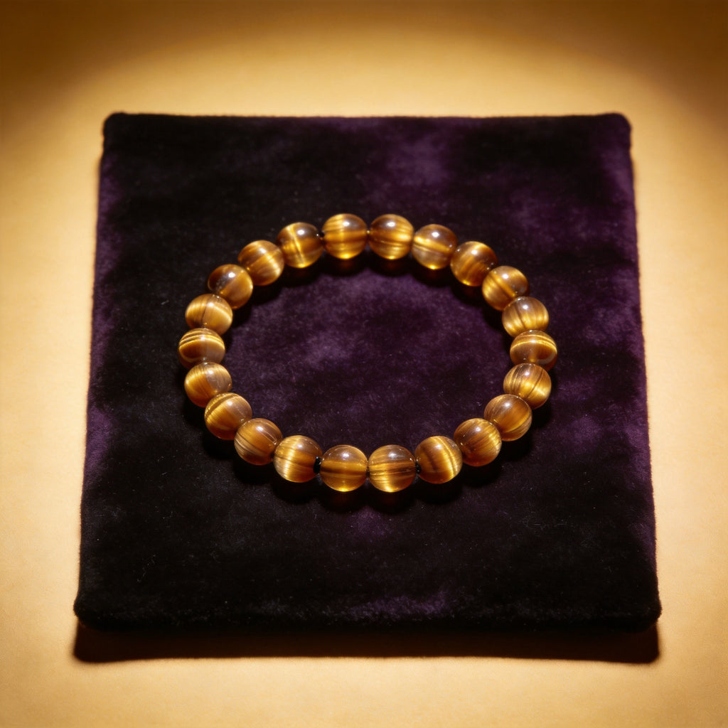Tiger Eye Women's 8mm natural stone bracelet on dark velvet